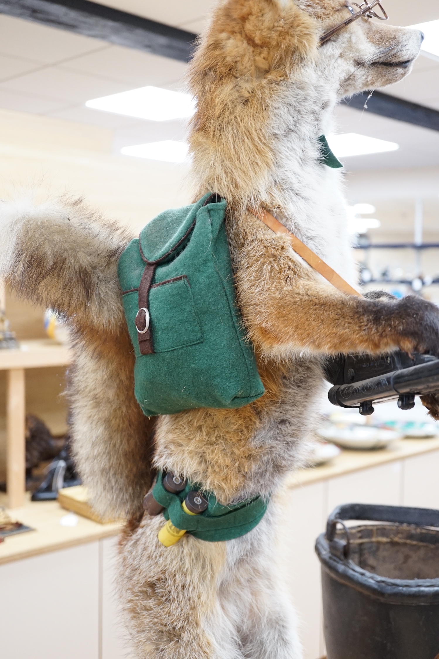 A novelty taxidermy fox group, 100cm high